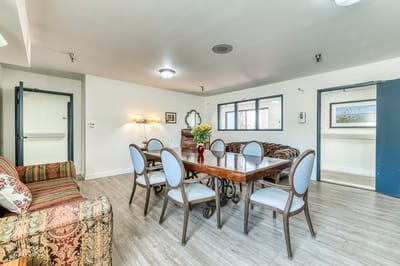 A common area with dining table and seating
