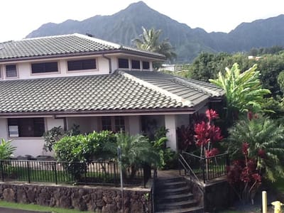 Exterior view of Kīnā ‘Ole Estate surrounded by greenery