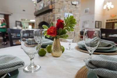 Beautiful dining setup with flowers and glassware
