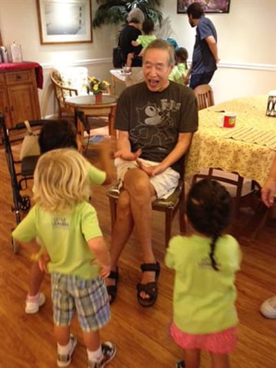 Residents interacting with children in a common area