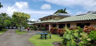 Exterior view of Kīnā ‘Ole Estate with landscaped garden
