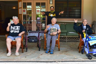 Residents socializing in a courtyard area.