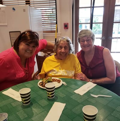 Residents enjoying a meal together in a dining area