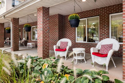 Outdoor seating area with decorative chairs and plants