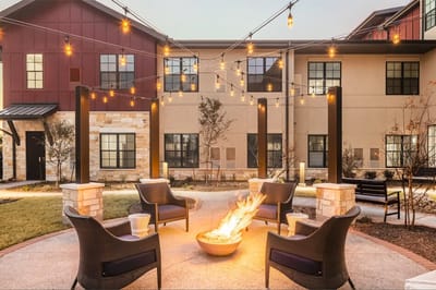 Outdoor lounge area with fire pit and seating