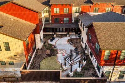 Aerial view of the Longleaf Bee Cave facility with landscaped courtyard