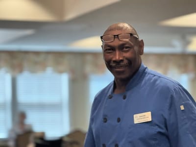Staff member smiling in a common area