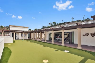 Outdoor social area with residents and lawn