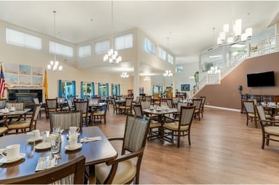 Bright dining room with tables set for meals