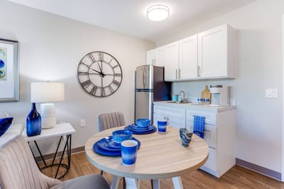 Cozy kitchen area in a resident room with a dining table