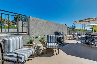 Outdoor seating area with grill and patio