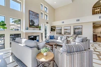 Bright and inviting lounge area with seating and artwork