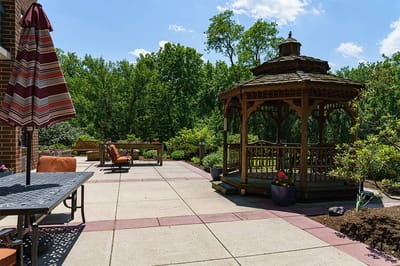 Outdoor patio area with gazebo and seating