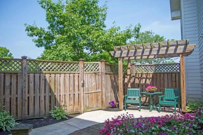 Private outdoor seating area with flowers