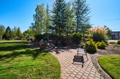 A serene outdoor space with landscaping and seating