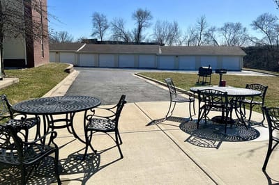 Outdoor seating area with tables and chairs