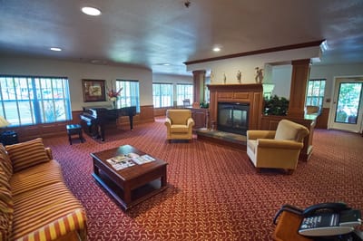 Interior common area with seating and a piano
