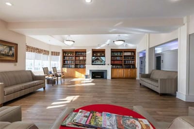 Bright common area with seating and bookshelves
