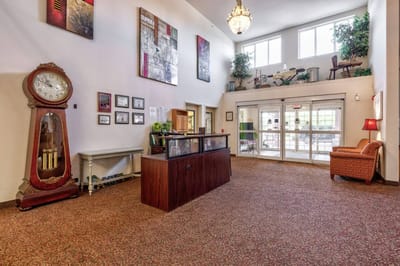 Interior view of a lobby with clock and seating