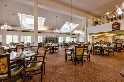 Bright and spacious dining area with tables set for meals