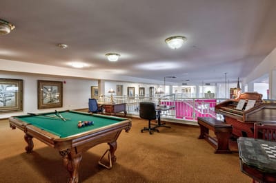 Interior view of a recreational area with a pool table