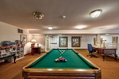 Interior view of a game room with a pool table