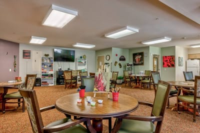 Activity room with tables and art supplies