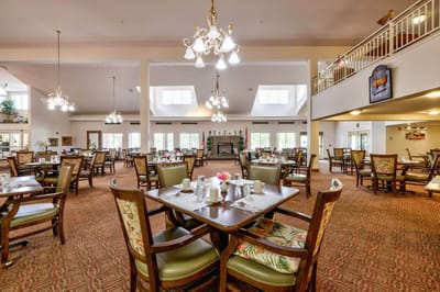 Bright dining room with tables set for meals