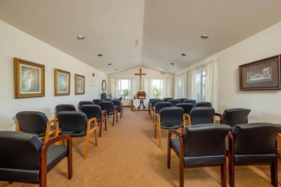 Interior view of a quiet chapel with seats