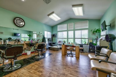 Interior view of a hair salon with styling stations