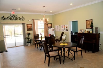 Bright and inviting common area with tables and chairs