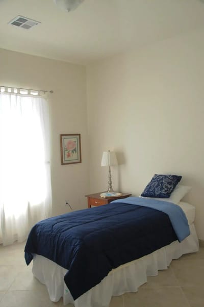 Private resident room with a bed and window
