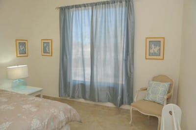 Cozy interior room with floral bedding and natural light
