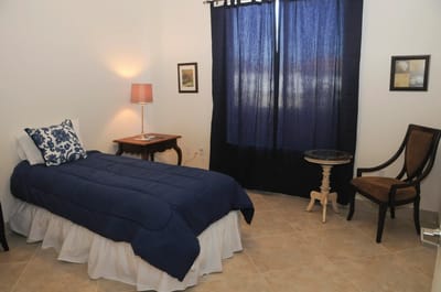 Cozy private resident room with bed and lamp