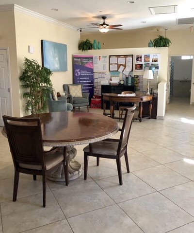 Bright common area with tables and chairs