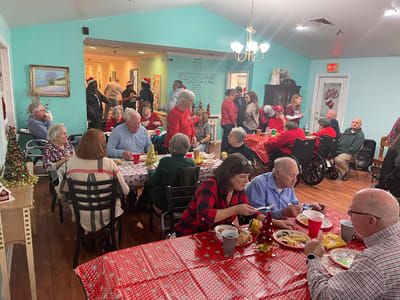 Residents enjoying a holiday meal together in a dining area