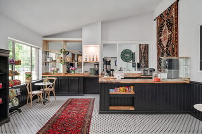 Interior view of a communal dining area with a cozy layout.