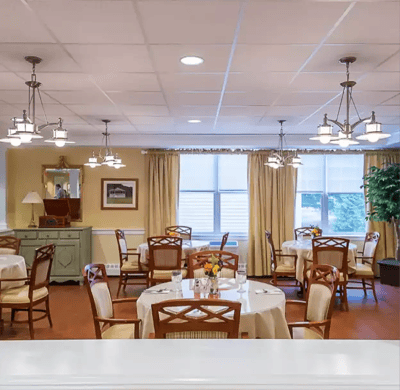 Bright dining area with tables and chairs