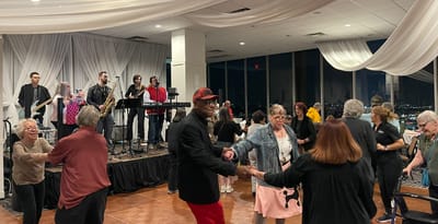 Residents dancing at a lively music event