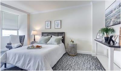Cozy bedroom setup with comfortable bedding and decor.