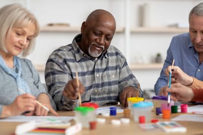 Residents engaged in a creative painting activity
