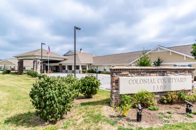 Exterior view of Colonial Courtyard at Clearfield with signage