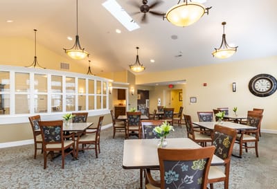 Bright dining area with tables and chairs
