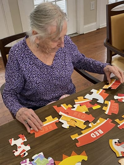 Resident working on a colorful puzzle