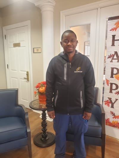 Staff member in a common area with decorations