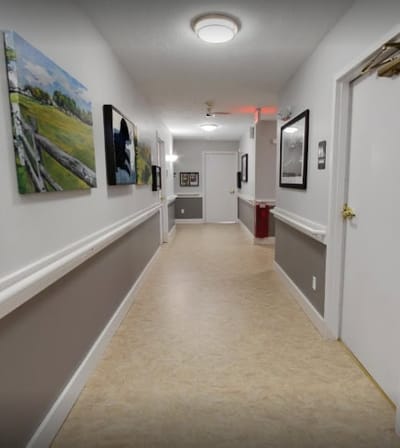 Bright indoor hallway with artwork and decor