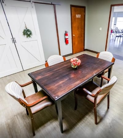 Table and chairs in a common area of the facility
