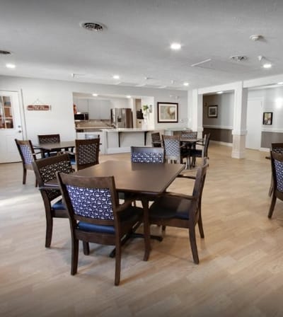 Warm dining area with tables and chairs