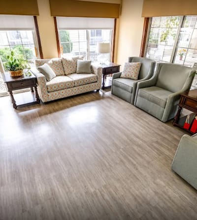 Bright common area with seating and plants