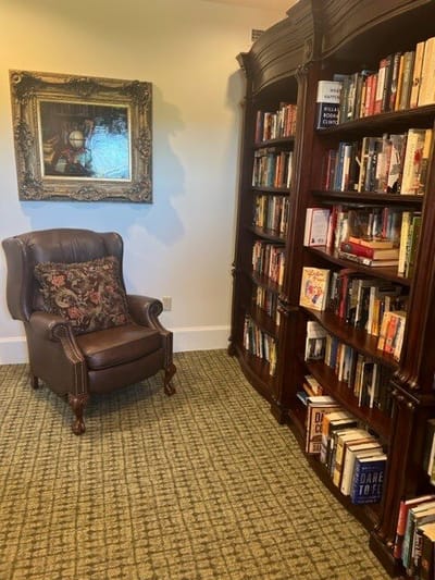 Cozy reading corner with armchair and bookshelf